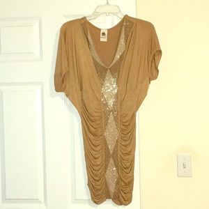 Golden cocktail dress with gems down the bodice